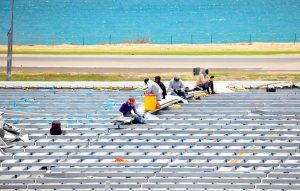 SXM Airport roof repair workers