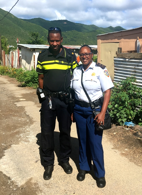 Elvis Jamanika of the National Dutch Police force and community officer Arcella Leonard patrol their assigned neighbourhoods daily