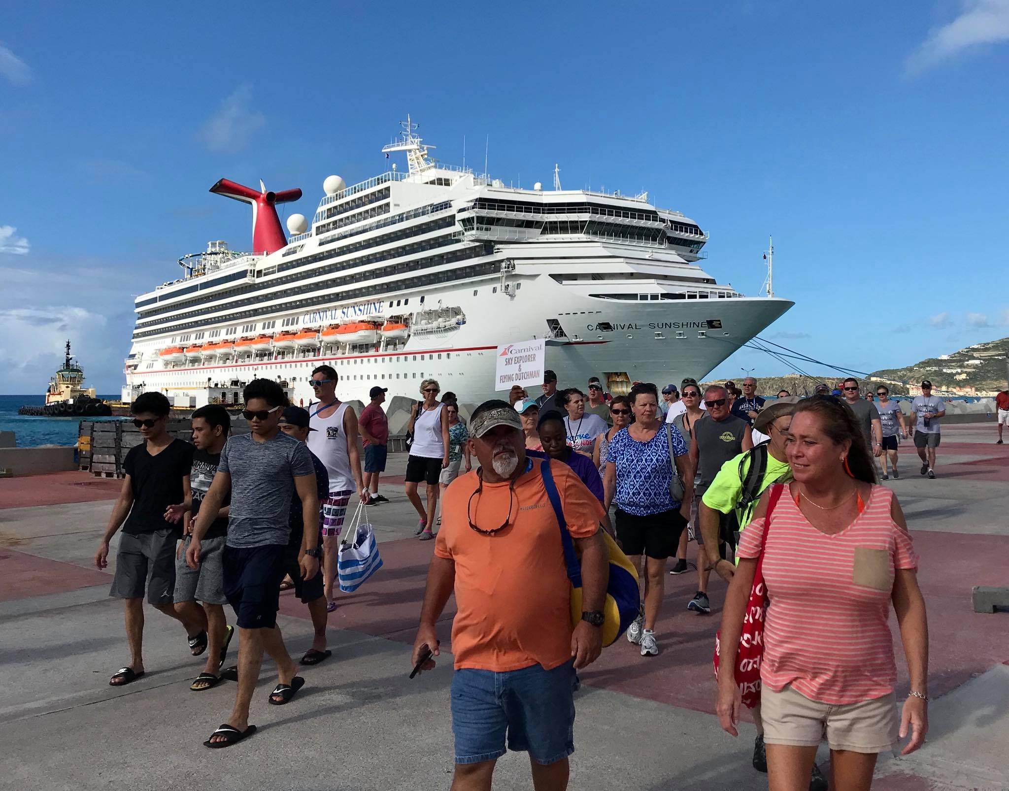 Carnival Sunshine with passengers disembarking