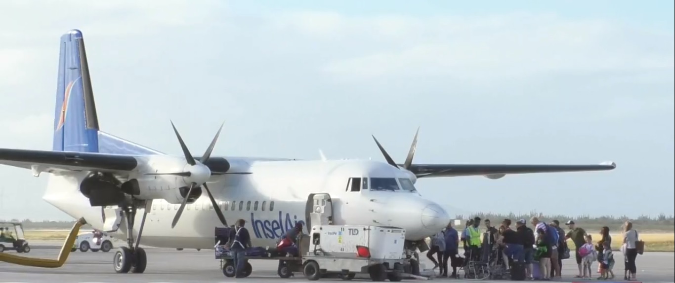 Inselair - Fokker 70 with passengers boarding